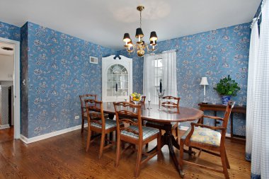 Dining room with blue wallpaper clipart