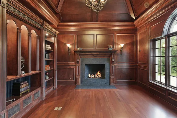 Elegant library with black fireplace — Stock Photo, Image