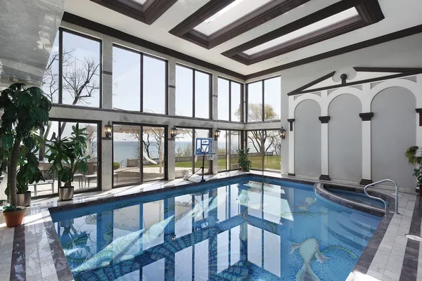 Indoor swimming pool with lake view — Stock Photo, Image