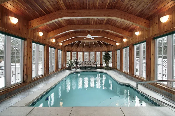 Swimming pool with wood ceiling beams — Stock Photo, Image