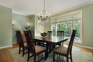 Dining room with green walls clipart