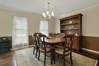 Dining room with oak wood table clipart