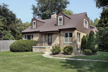 Brick home with stone entry clipart