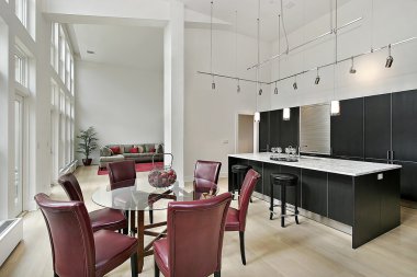 Two story kitchen with black cabinetry clipart