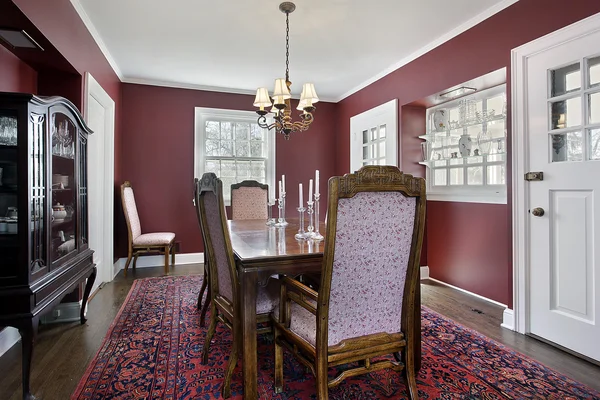 Dining room with maroon walls — Stock Photo, Image