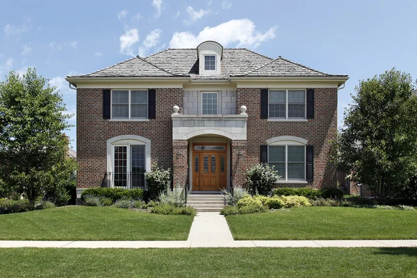 Brick home with front archway — Stock Photo, Image