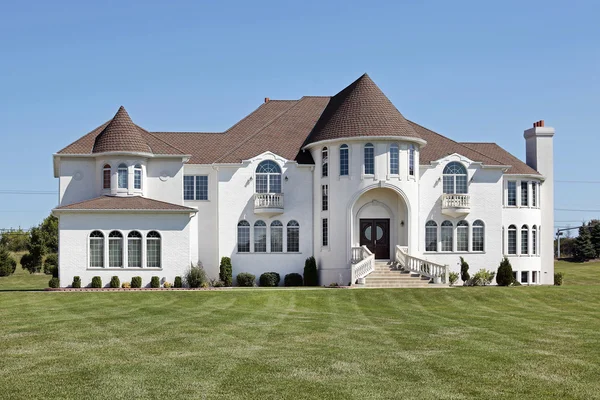 Luxury white home with front turret — Stock Photo, Image