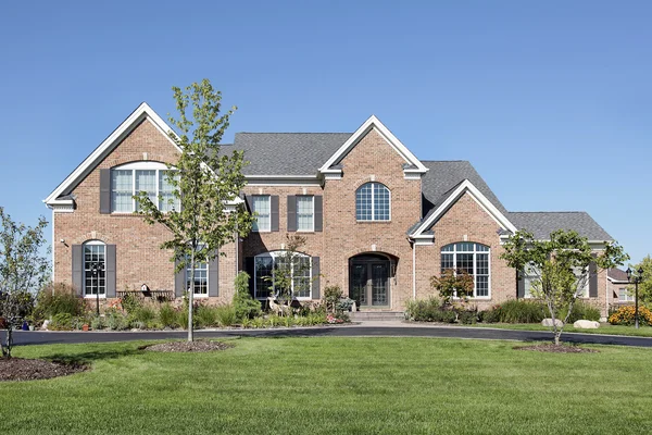 Brick home with arched entry — Stock Photo, Image