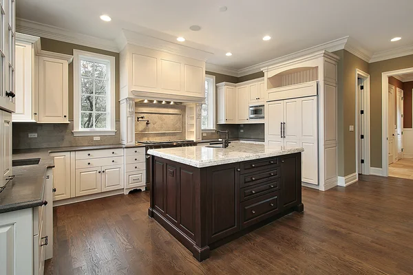 Kitchen with wood and granite island Royalty Free Stock Images