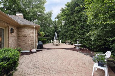 Brick patio with rock garden clipart