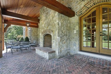 Brick patio with stone fireplace clipart