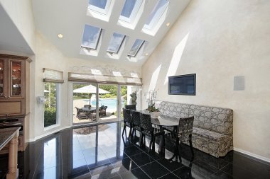 Sitting area with skylights and pool view clipart