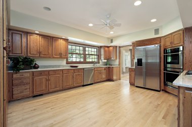 Kitchen with oak wood cabinetry clipart