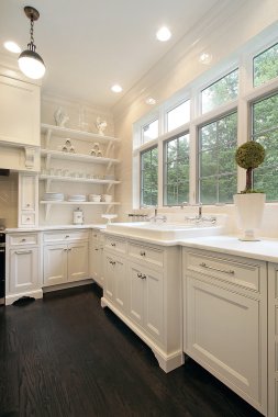 Contemporary kitchen with white cabinetry clipart