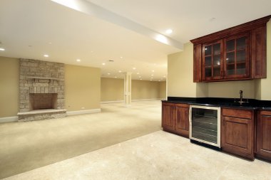 Basement with bar and fireplace clipart