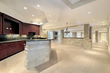 Stone bar and kitchen in basement clipart