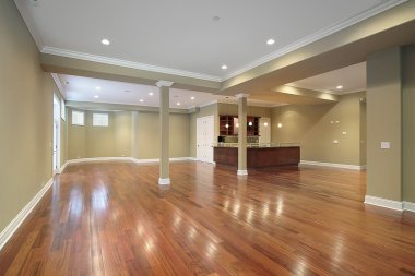 Basement with kitchen in new construction home clipart