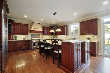 Kitchen with cherry wood cabinetry clipart