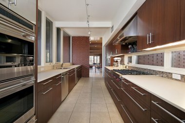 Kitchen with dark wood cabinetry clipart