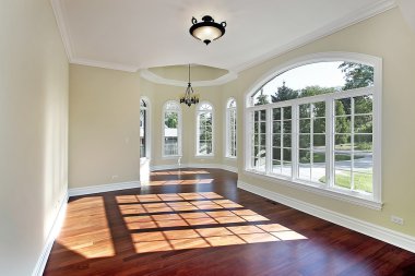 Dining room with cherry wood flooring clipart