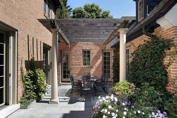 stock image Bluestone patio and wood pergola