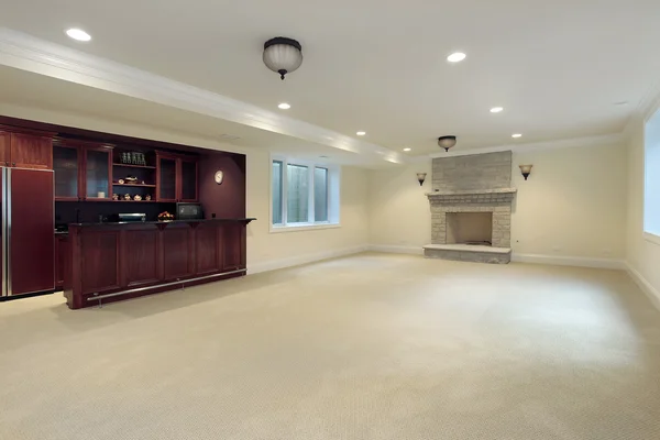 Basement with fireplace and bar — Stock Photo, Image