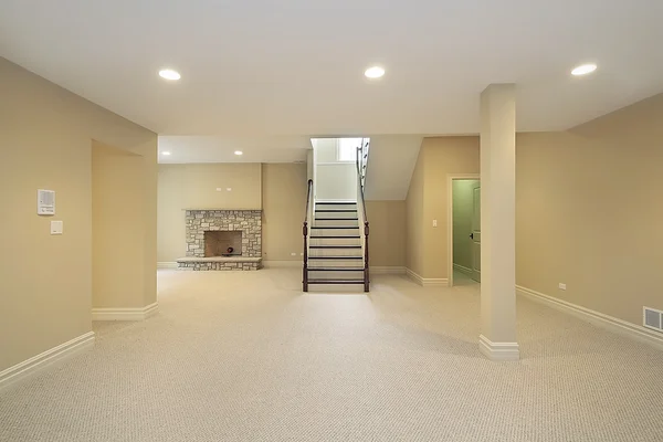 Basement with stone fireplace — Stock Photo, Image