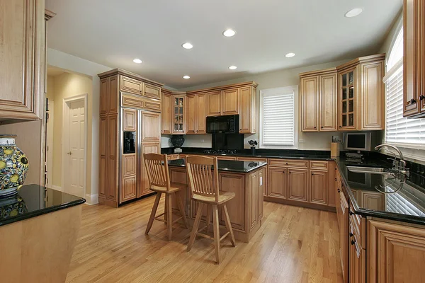 Large kitchen with wood cabinetry — Stock Photo, Image