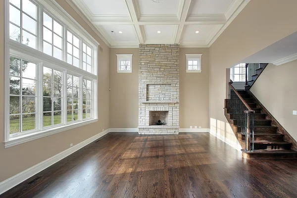 Family room with two story fireplace — Stock Photo, Image