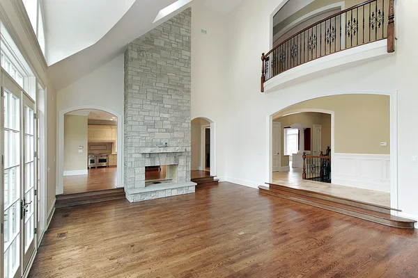 Family room with two story fireplace — Stock Photo, Image