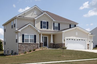 Suburban home with stonework clipart