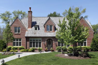 Luxury home with cedar shake roof clipart