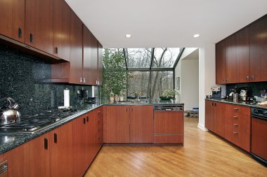 Kitchen with glass enclosed eating area clipart