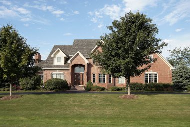 Luxury suburban brick home clipart