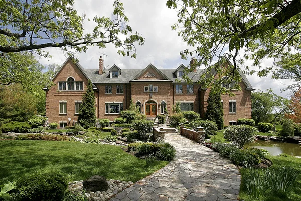 Luxury home with stone walkway — Stock Photo, Image