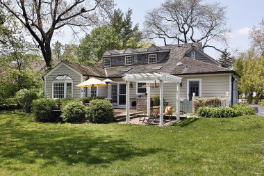 Home with back yard pergola clipart