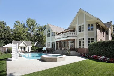 Rear view of home with swimming pool