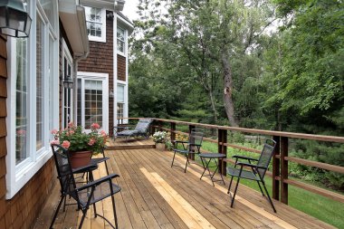 Large wood deck of luxury home clipart