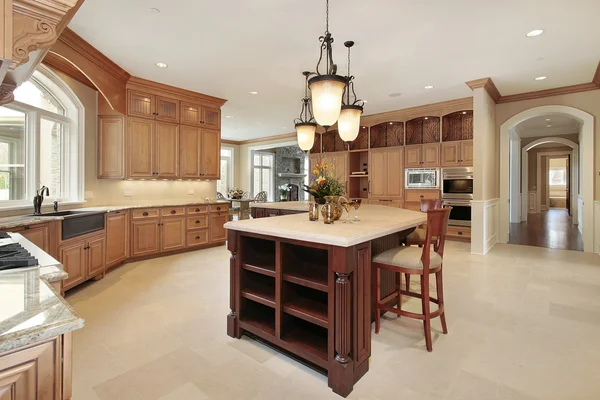 Large kitchen with wood cabinetry Stock Image