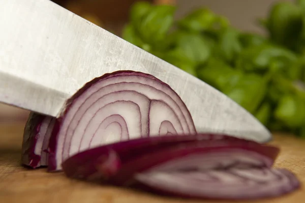 Stock image Slicing a Red Onion