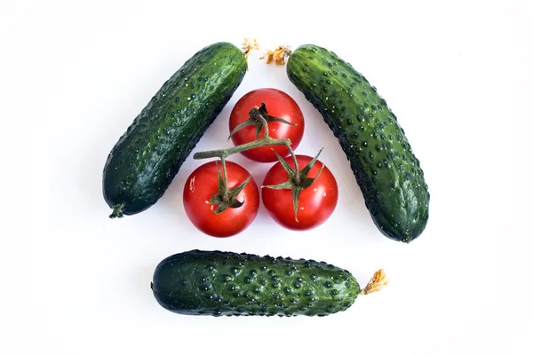 Tomatoes and cucumbers — Stock Photo, Image