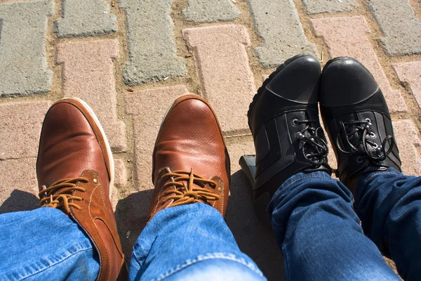 Male & female legs in boots Stock Photo