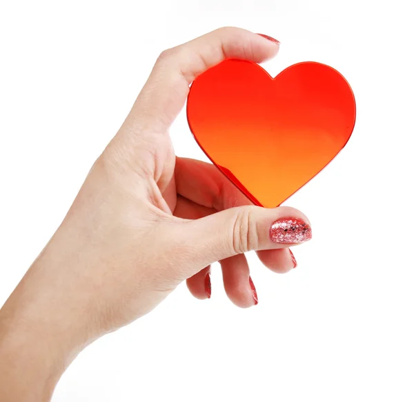 Красное сердце в руке — стоковое фото