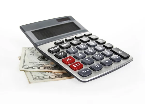 Kalkulačka a peníze 20 dolarů bankovek — Stock fotografie