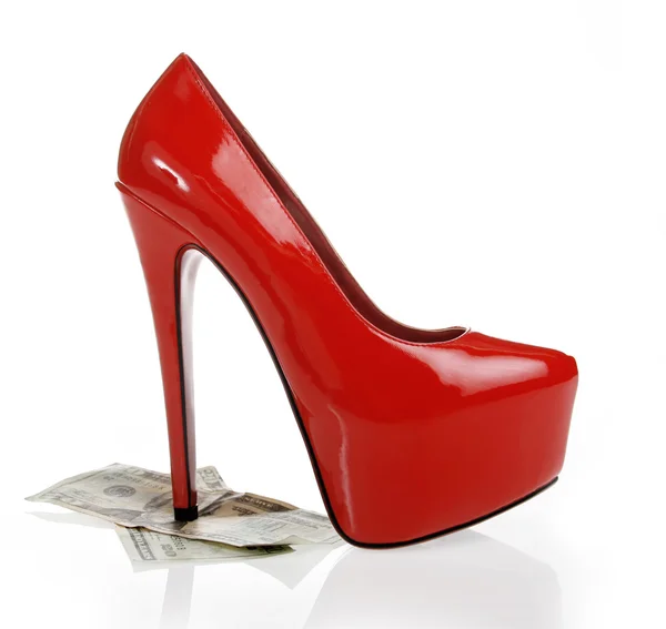 Money under a red heel — Stock Photo, Image