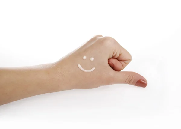 Mão com creme sorridente — Fotografia de Stock