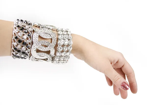 Silver bracelets on woman hand — Stock Photo, Image
