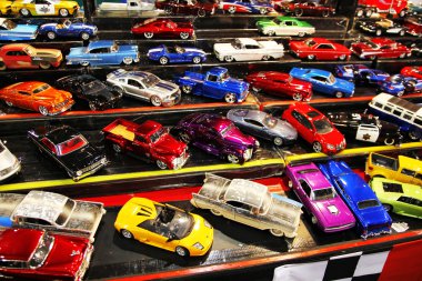 Parking of colorful small model cars clipart