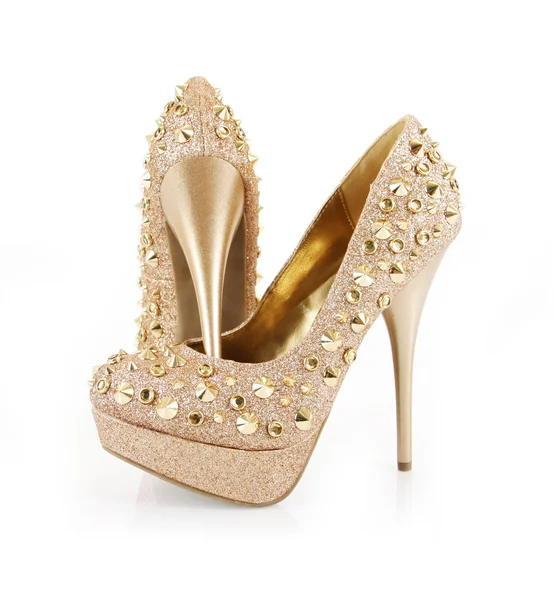 Glitter spiked golden shoes — Stock Photo, Image