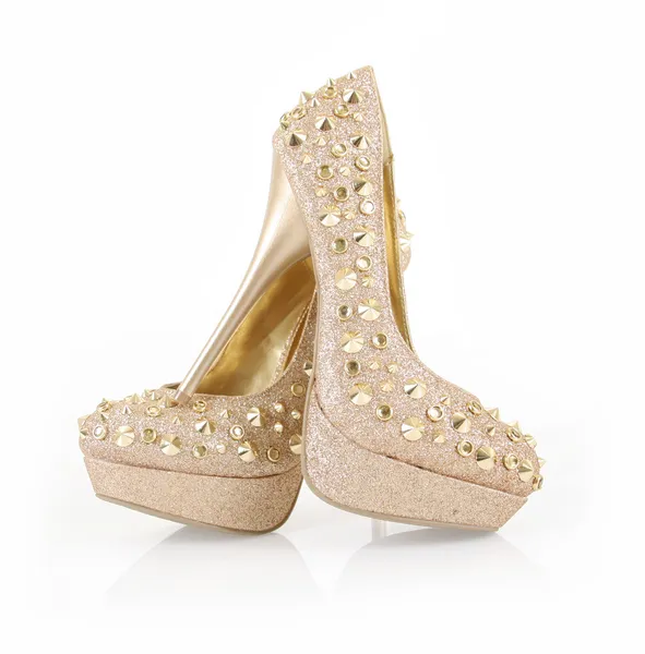 Glitter spiked gold shoes — Stock Photo, Image